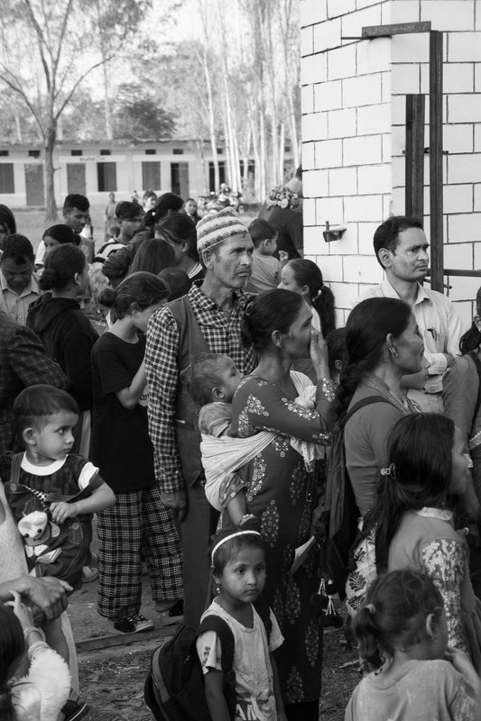 Waiting together in front of the school 